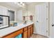 This bathroom features wood cabinets, a large mirror, and neutral paint at 6071 Sugar Pine Dr, Avon, IN 46123