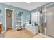 Bright bathroom featuring a soaking tub with separate shower and decorative shelving at 6071 Sugar Pine Dr, Avon, IN 46123
