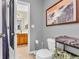 An open doorway shows a vanity and closet, while the foreground features a toilet and decorations at 6071 Sugar Pine Dr, Avon, IN 46123