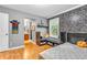 Bedroom with brick accent wall and window seat, and an attached bathroom at 6071 Sugar Pine Dr, Avon, IN 46123