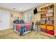 Inviting bedroom with built-in shelving, a window for natural light, and cozy bedding at 6071 Sugar Pine Dr, Avon, IN 46123