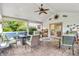 Inviting covered patio with comfortable seating, ceiling fan, and outdoor decor at 6071 Sugar Pine Dr, Avon, IN 46123