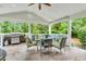 Stylish covered patio with a grill, comfortable seating, and a ceiling fan at 6071 Sugar Pine Dr, Avon, IN 46123