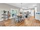 Bright dining area with ample seating for six, seamlessly connected to the kitchen and outdoor spaces at 6071 Sugar Pine Dr, Avon, IN 46123