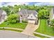 Attractive brick and siding two-story home with well-manicured lawn and mature trees at 6071 Sugar Pine Dr, Avon, IN 46123
