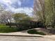Charming community building nestled amongst mature trees and lush landscaping with a winding walkway to the front door at 6071 Sugar Pine Dr, Avon, IN 46123