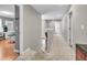 A hallway showcasing carpet, neutral paint colors, and views into other rooms like an office at 6071 Sugar Pine Dr, Avon, IN 46123