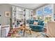 Cozy living room with built-in bookshelves, a comfortable chair, and a colorful area rug at 6071 Sugar Pine Dr, Avon, IN 46123