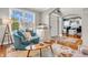 Inviting living room with hardwood floors, a cozy round chair, and a window showcasing natural light at 6071 Sugar Pine Dr, Avon, IN 46123