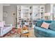 Inviting living space featuring ample shelving, hardwood floors, and a vibrant accent rug at 6071 Sugar Pine Dr, Avon, IN 46123