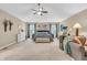 A spacious main bedroom boasts vaulted ceilings, ceiling fan, lounge area, and ample natural light at 6071 Sugar Pine Dr, Avon, IN 46123
