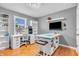 Bright office space with custom desk and shelving, plus a large window for natural light at 6071 Sugar Pine Dr, Avon, IN 46123