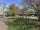 Well-maintained playground with grass, a fence and mature trees and bushes at 6071 Sugar Pine Dr, Avon, IN 46123