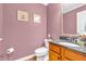 A charming powder room features granite countertops, decorative mirror, and updated fixtures at 6071 Sugar Pine Dr, Avon, IN 46123