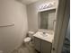 Clean bathroom featuring a vanity with a sink, a toilet, and a shower with glass doors at 6083 White Birch Dr, Fishers, IN 46038