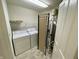 Functional laundry room featuring a washer, dryer, and a water heater at 6083 White Birch Dr, Fishers, IN 46038