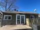 Backyard view of a single-story home, showing windows, a sliding glass door, and a fenced-in yard at 635 Laclede St, Indianapolis, IN 46241