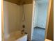 View of a bathroom showcasing a shower/tub combo with an open doorway at 635 Laclede St, Indianapolis, IN 46241