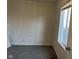 Vacant bedroom features carpet, a window, and freshly painted white walls at 635 Laclede St, Indianapolis, IN 46241