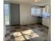 Kitchen with checkered floor tiles, a window for light, and access to the exterior through a back door at 635 Laclede St, Indianapolis, IN 46241