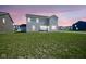 Spacious backyard with a large grass area, perfect for outdoor activities and relaxation at 7140 Leatherwood Dr, Indianapolis, IN 46259