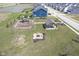 Aerial view of a neighborhood park with playground, picnic shelter, and fire pit, perfect for outdoor fun at 7140 Leatherwood Dr, Indianapolis, IN 46259