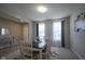 Charming dining room with elegant accents and decor, illuminated by natural light from nearby windows at 7140 Leatherwood Dr, Indianapolis, IN 46259
