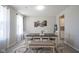 Bright dining room with a large table and a bench, complete with views to the kitchen at 7140 Leatherwood Dr, Indianapolis, IN 46259