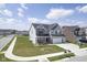 Attractive two-story home with attached two car garage and well-manicured lawn on a sunny day at 7140 Leatherwood Dr, Indianapolis, IN 46259