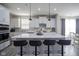 Bright kitchen features a large center island with pendant lighting and modern appliances at 7140 Leatherwood Dr, Indianapolis, IN 46259