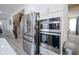 Modern kitchen features stainless steel refrigerator, oven, and updated fixtures at 7140 Leatherwood Dr, Indianapolis, IN 46259