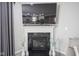 Cozy living room features a fireplace with a mounted TV and modern decor at 7140 Leatherwood Dr, Indianapolis, IN 46259