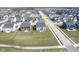 Aerial view showcasing a meticulously planned neighborhood with sidewalks, streets and homes in a harmonious streetscape at 7140 Leatherwood Dr, Indianapolis, IN 46259