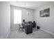 Functional home office features neutral colors, a large desk, and modern decor at 7140 Leatherwood Dr, Indianapolis, IN 46259