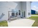 View of the patio with a swing, view of the house siding and sliding glass door at 7140 Leatherwood Dr, Indianapolis, IN 46259