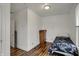 Bright bedroom featuring hardwood floors, a single bed, and a wooden dresser at 725 N Sheffield Ave, Indianapolis, IN 46222