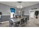 Elegant dining room with sophisticated gray walls, stylish furniture, and modern light fixtures at 725 N Sheffield Ave, Indianapolis, IN 46222
