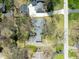 An aerial view of a lovely single-story home with mature landscaping and a detached garage at 7575 Holliday W Dr, Indianapolis, IN 46260