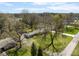 An aerial shot of a single-story home in a verdant, well-maintained neighborhood at 7575 Holliday W Dr, Indianapolis, IN 46260