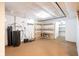 Unfinished basement with concrete floor and wooden shelving at 7575 Holliday W Dr, Indianapolis, IN 46260
