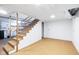 Unfinished basement with stairs leading up to the main floor at 7575 Holliday W Dr, Indianapolis, IN 46260