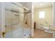 Bathroom featuring tiled walls, glass shower, and safety handles at 7575 Holliday W Dr, Indianapolis, IN 46260