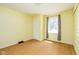 Bedroom featuring a window and light yellow walls at 7575 Holliday W Dr, Indianapolis, IN 46260