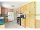 Eat-in kitchen featuring tile floors, light-colored cabinets, and stainless steel appliances at 7575 Holliday W Dr, Indianapolis, IN 46260