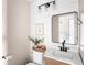 Bright bathroom features white ship lap, modern vanity, contemporary lighting and neutral walls at 7914 Cardinal E Cv, Indianapolis, IN 46256