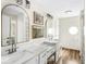 Bright bathroom with double vanity, quartz countertop, and stylish decor at 7914 Cardinal E Cv, Indianapolis, IN 46256
