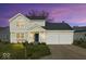 Two-story home featuring a well-manicured lawn, two-car garage, and a traditional design at 7914 Cardinal E Cv, Indianapolis, IN 46256