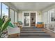 Bright sunroom with lots of natural light, comfortable seating, and easy access to the backyard at 7914 Cardinal E Cv, Indianapolis, IN 46256