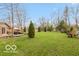 Expansive backyard featuring lush greenery and mature trees, perfect for outdoor activities at 7915 Allisonville Rd, Indianapolis, IN 46250