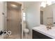 Fresh bathroom with a glass shower door, toilet, and vanity with a white sink at 7915 Allisonville Rd, Indianapolis, IN 46250